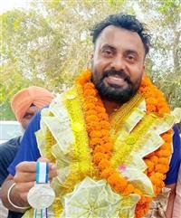 LAKHWINDER WINS SILVER IN WORLD MASTERS ATHLETICS