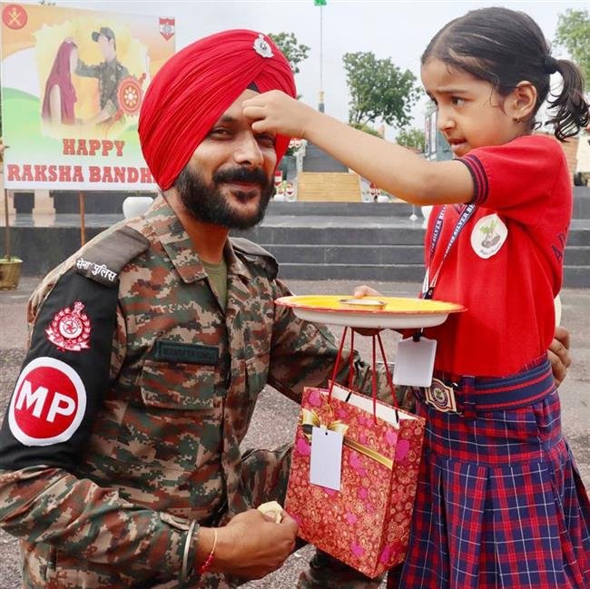 SCHOOL CHILDREN CELEBRATE RAKSHA BANDHAN WITH SOLDIERS